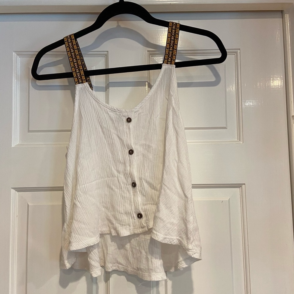 Delicate white top with embroidered straps